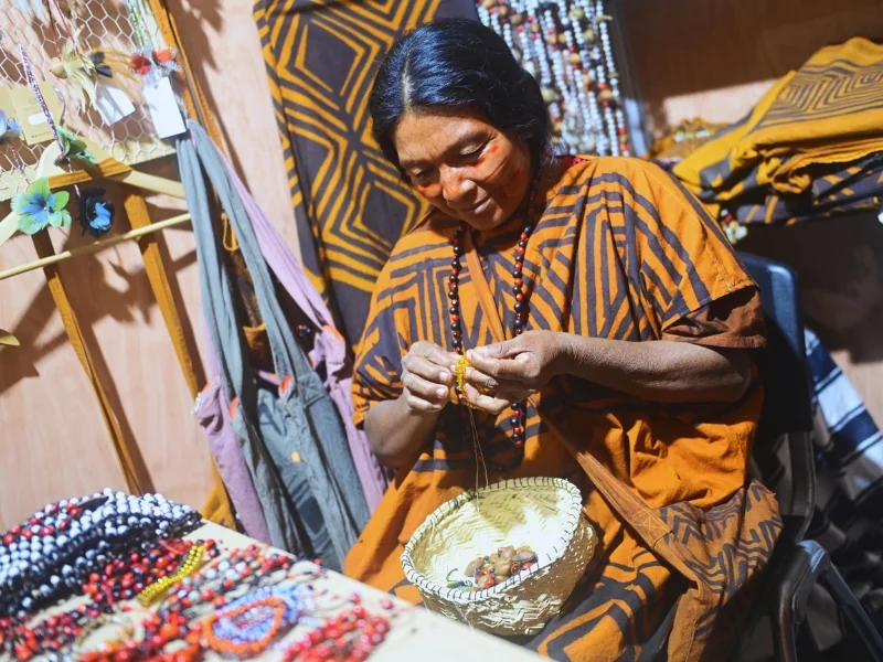Person from a territorial community working on local handcrafts